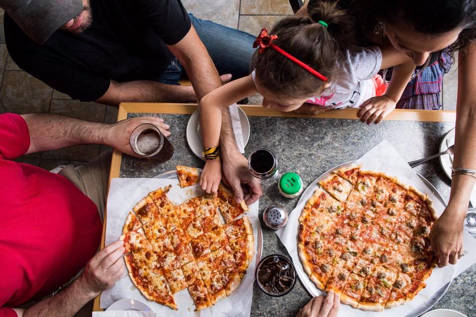 Family sharing Sammys pizza